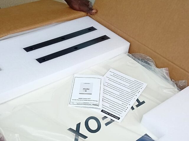 Joshua unboxing his TIGFOX battery delivery