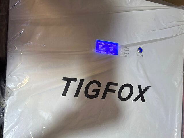 Justin's TIGFOX battery on first power-on, LCD showing Welcome